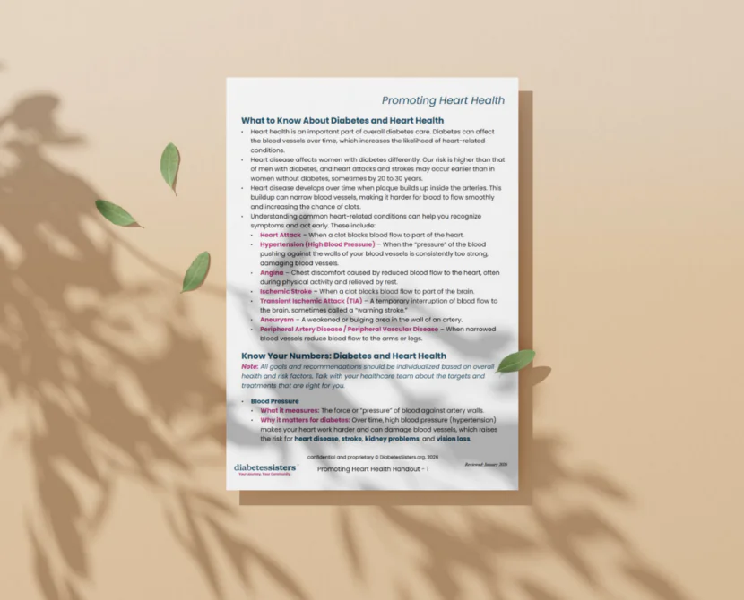 A flyer titled Promoting Heart Health with text about the link between diabetes and heart health, risk factors, and tips to prevent heart disease in diabetes, lies on a beige surface with green leaves casting shadows around it.