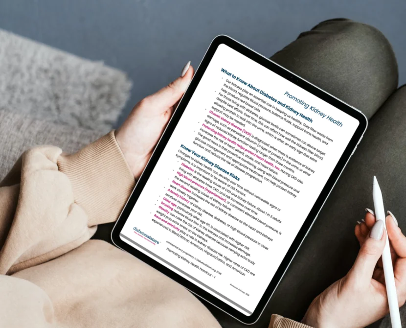 A person sitting on a couch, holding a tablet displaying a document titled Preventing Kidney Disease with a stylus in hand; the person is wearing a beige sweater and green pants.