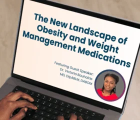 A person types on a laptop displaying an expert-series-webinar slide titled The New Landscape of Obesity and Weight Management Medications, featuring guest speaker Dr. Victoria Bouhairie with her photo in a circular frame, highlighting the value of peer support.